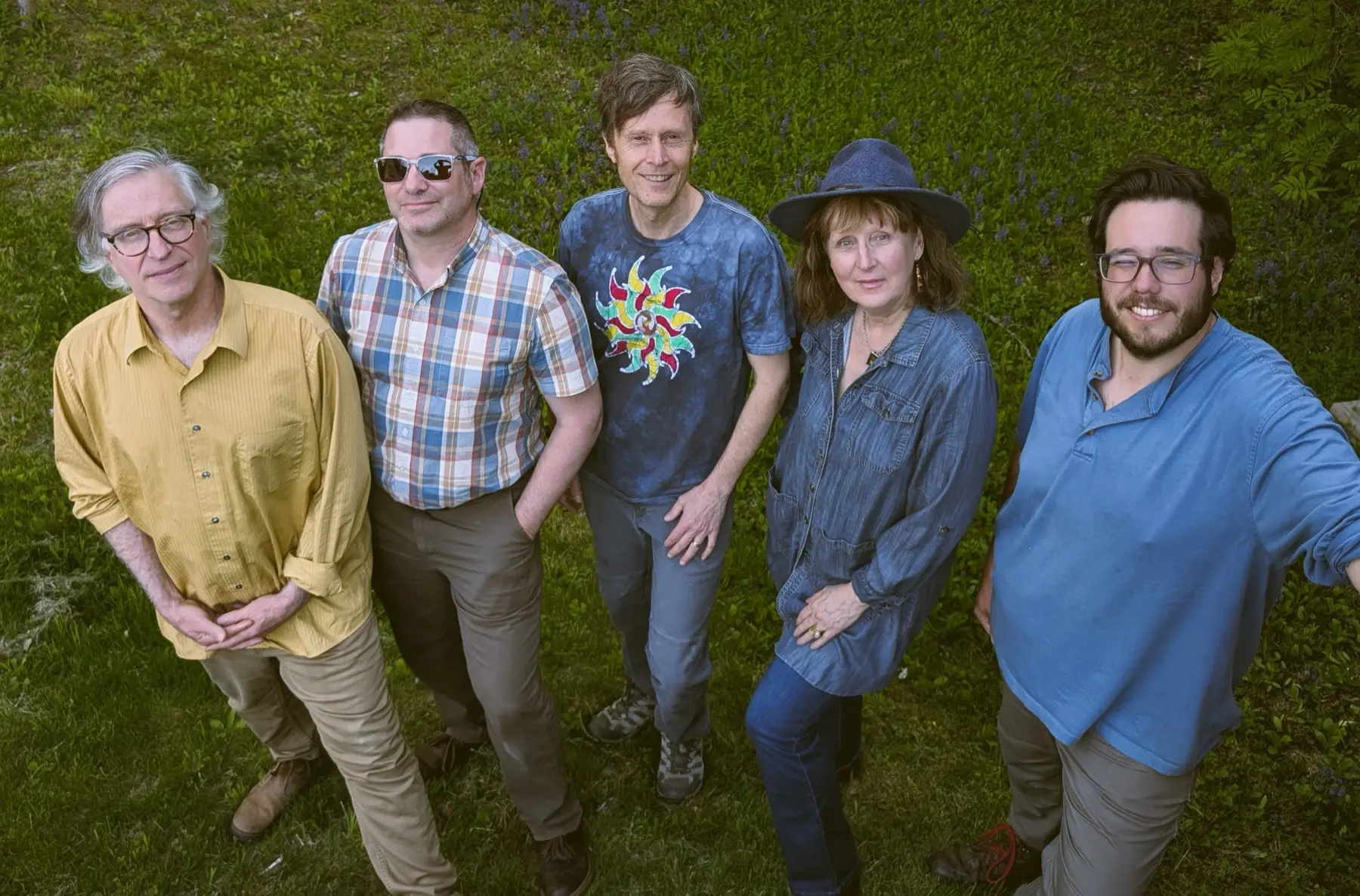 The Barn Band standing in a field in Thetford, Vermont